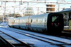 DSB IR4 2121 trainset photographed at the railwaystation in Fredericia 29. December 2004.  The IR4 was built by ABB Scandia in Denmark. Each unit consists of 3 coaches. Built in a number of 44 trainsets. The trainsets were put in service in 1989 - 1998. 4 electric engines of 420 kW per trainset. Max speed 180 km/h - 112 mph. Length 76 530 mm. Weight 133 metric tonnes. 24/16 seats 1st class, 183/183 + 20 seats 2nd class. Up to 5 trainsets can be put together.